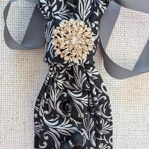 Elegant Black and White Brooch Tie